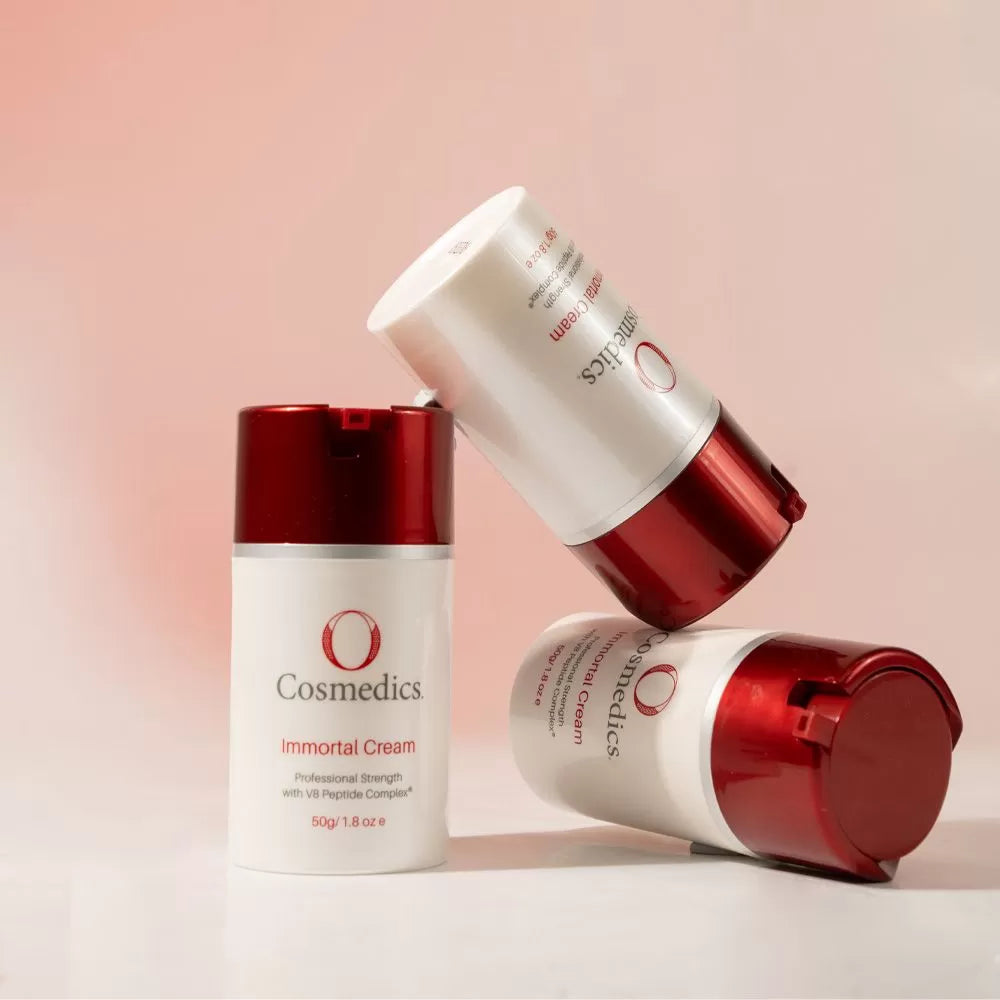 O Cosmedics Immortal Cream displayed against soft pink background, highlighting Amavi Beauty Loungeβs best-selling skincare product in Brisbane.