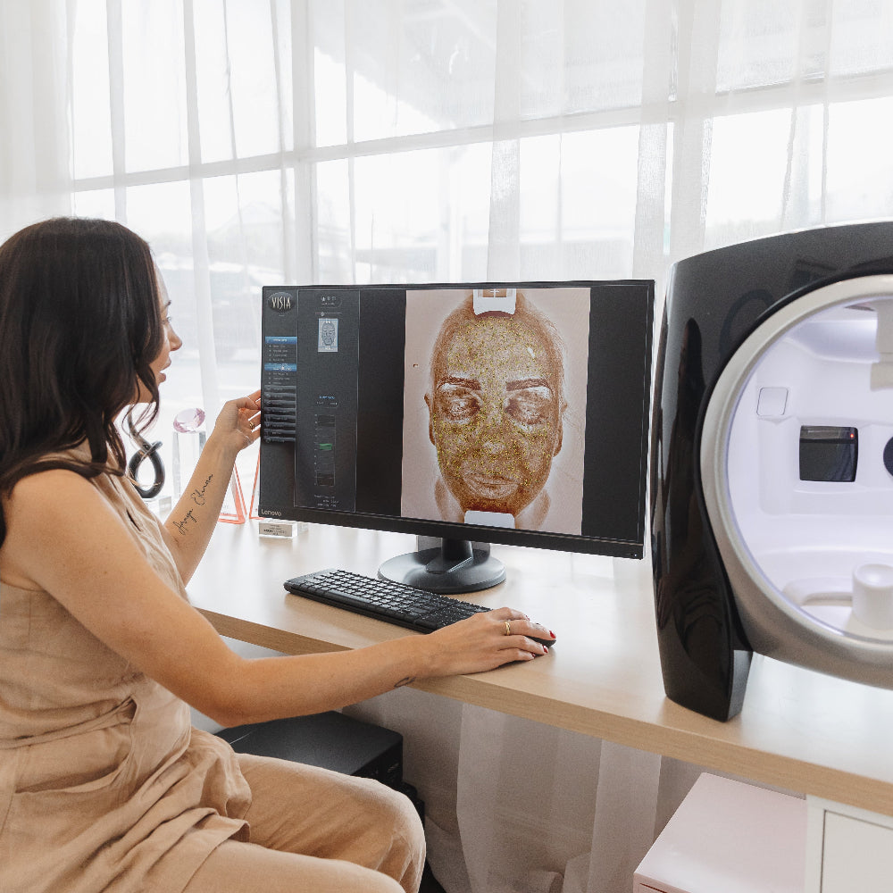 Leaha performing a professional skin analysis using VISIA technology at Amavi Beauty Lounge in Brisbane.