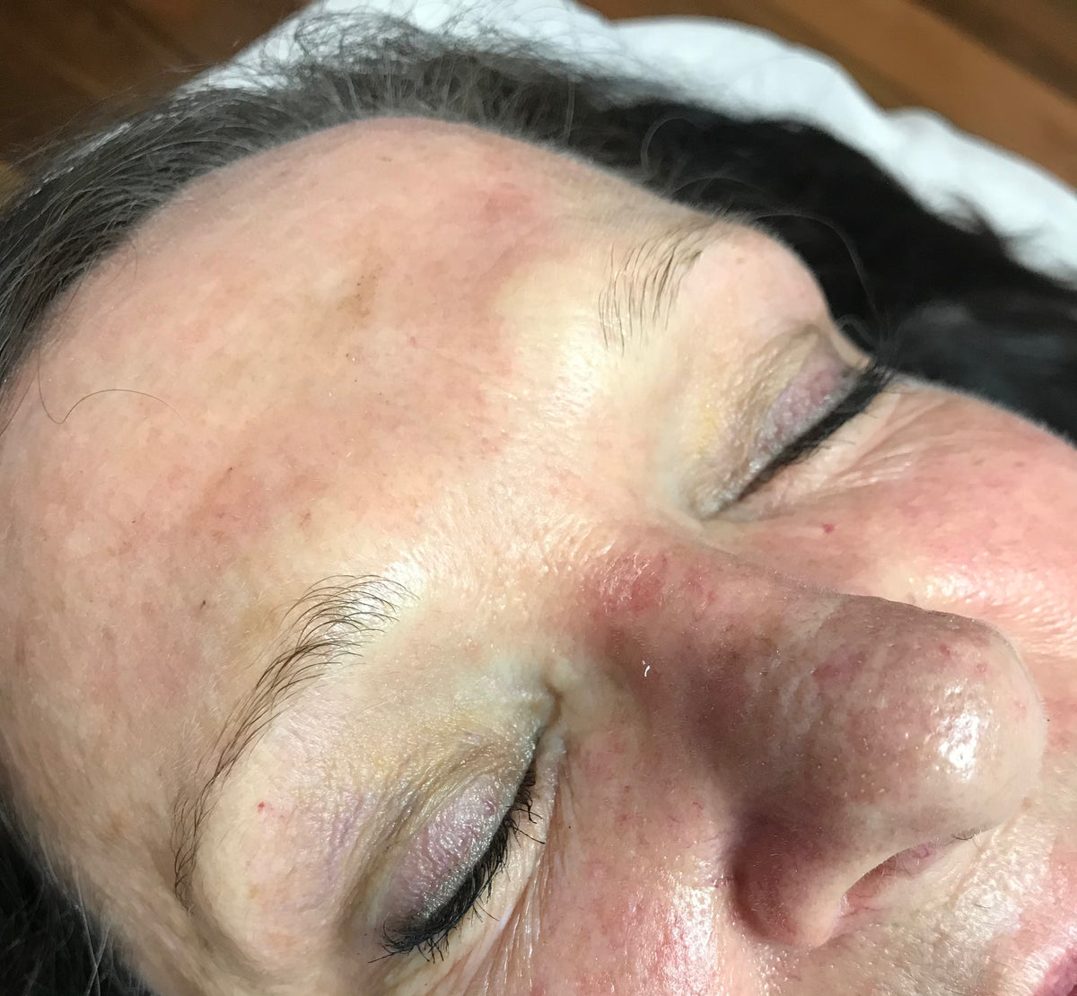 Client's brows before microblading, showing uneven, sparse brow hair