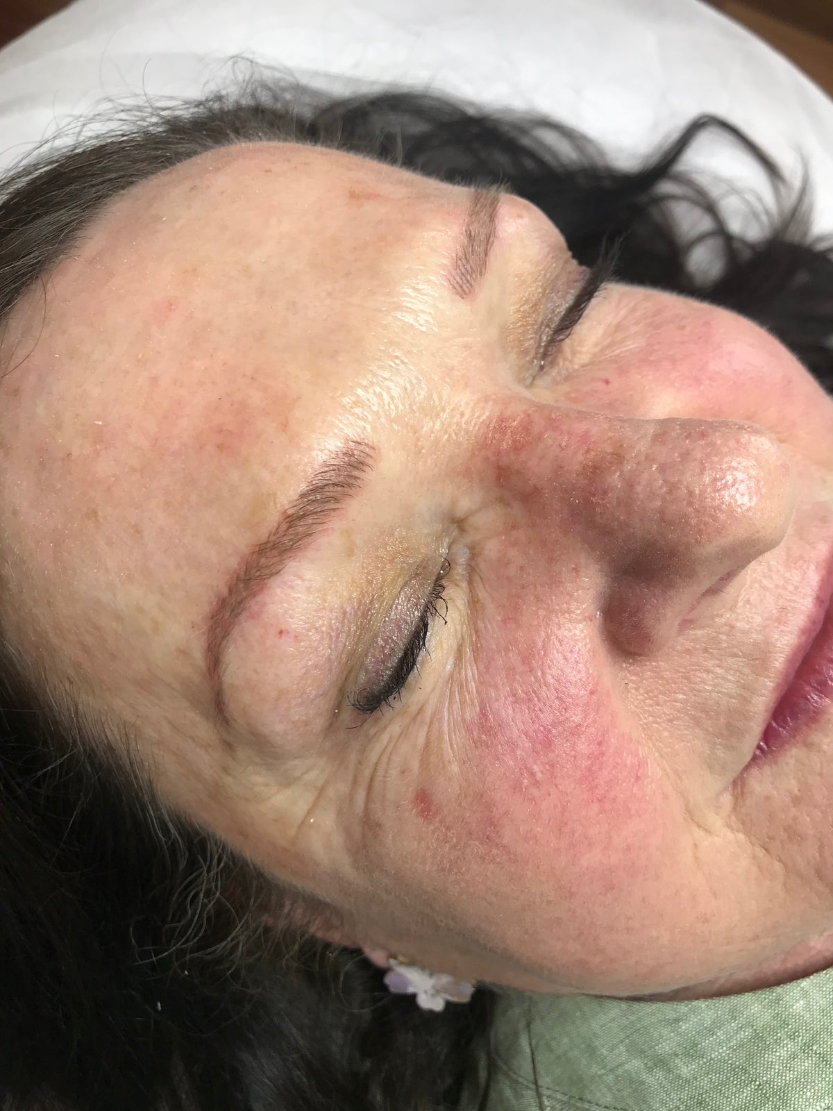 Healed microblading result with crisp hair strokes and balanced brow shape
